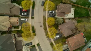 Aerial view of the suburbs showing front and back yards