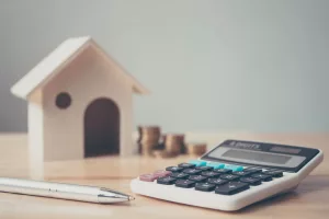 House and calculator. Home price concept image.